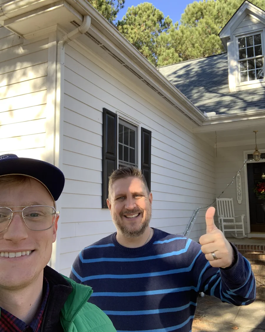 A happy homeowner with a brand-new roof