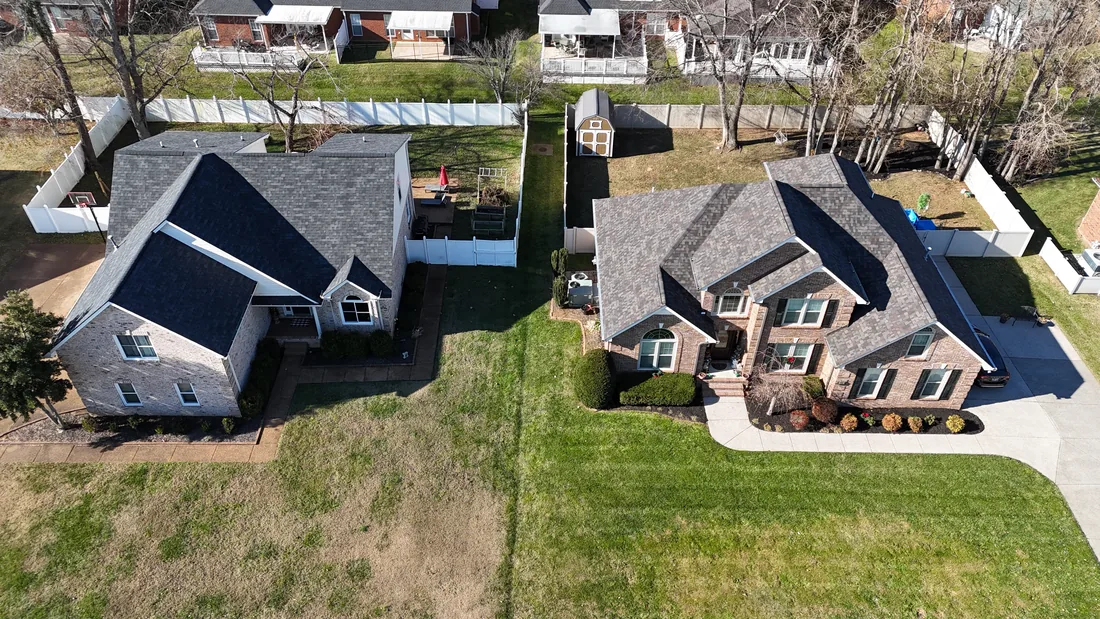 Two completed roofs in one neighborhood