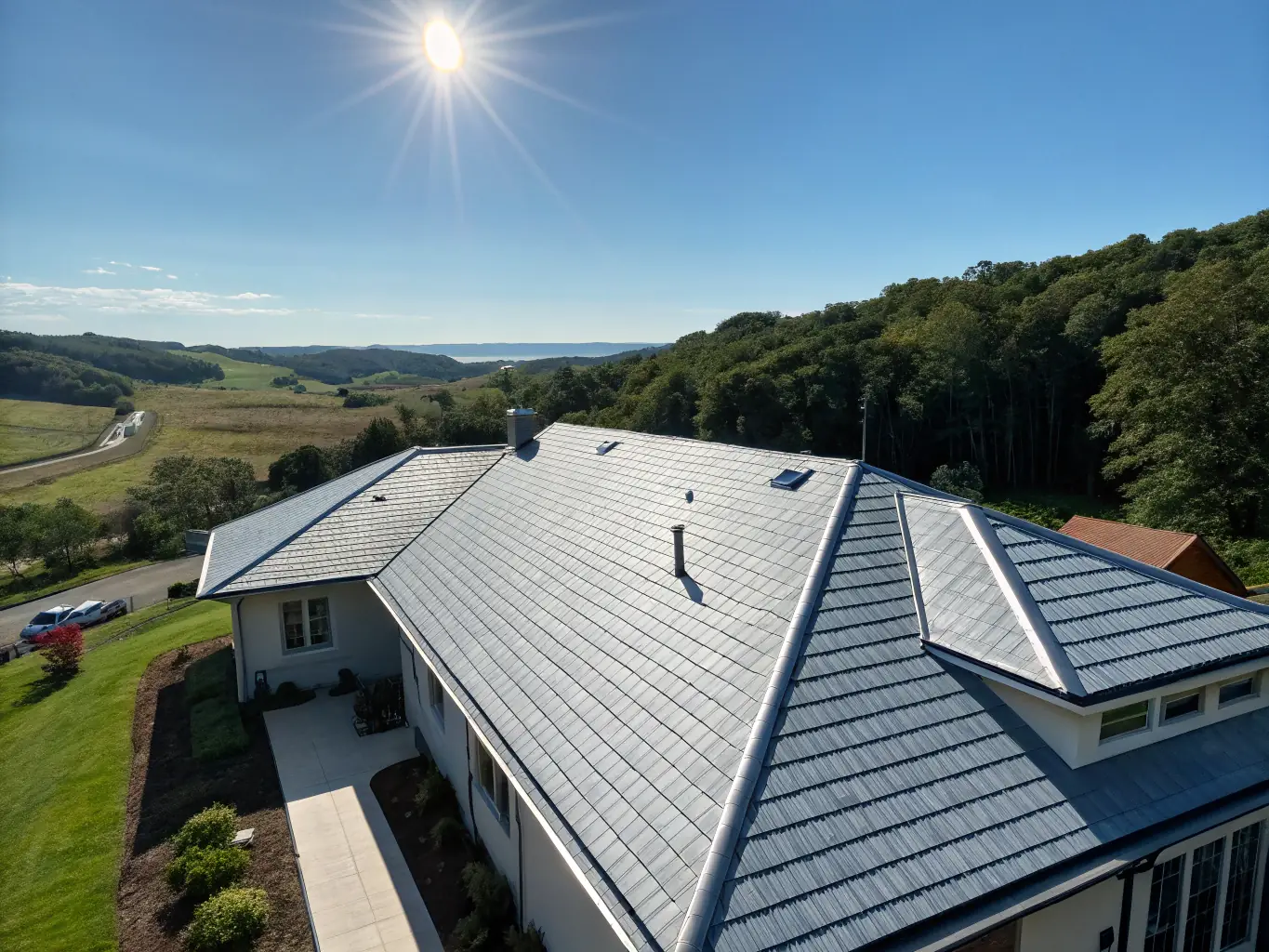 A wide shot of a well-maintained roof installed by Blue Raider Roofing, showcasing its durability and aesthetic appeal against a clear blue sky.